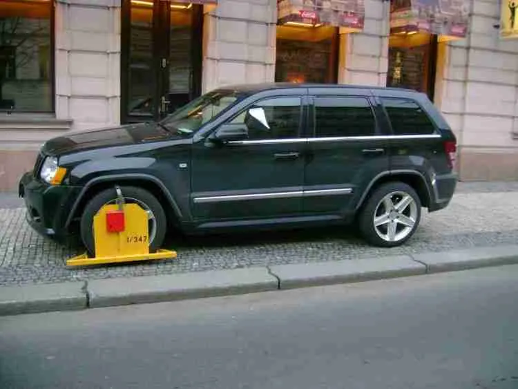 Can I legally clamp a car that's parked on my driveway?